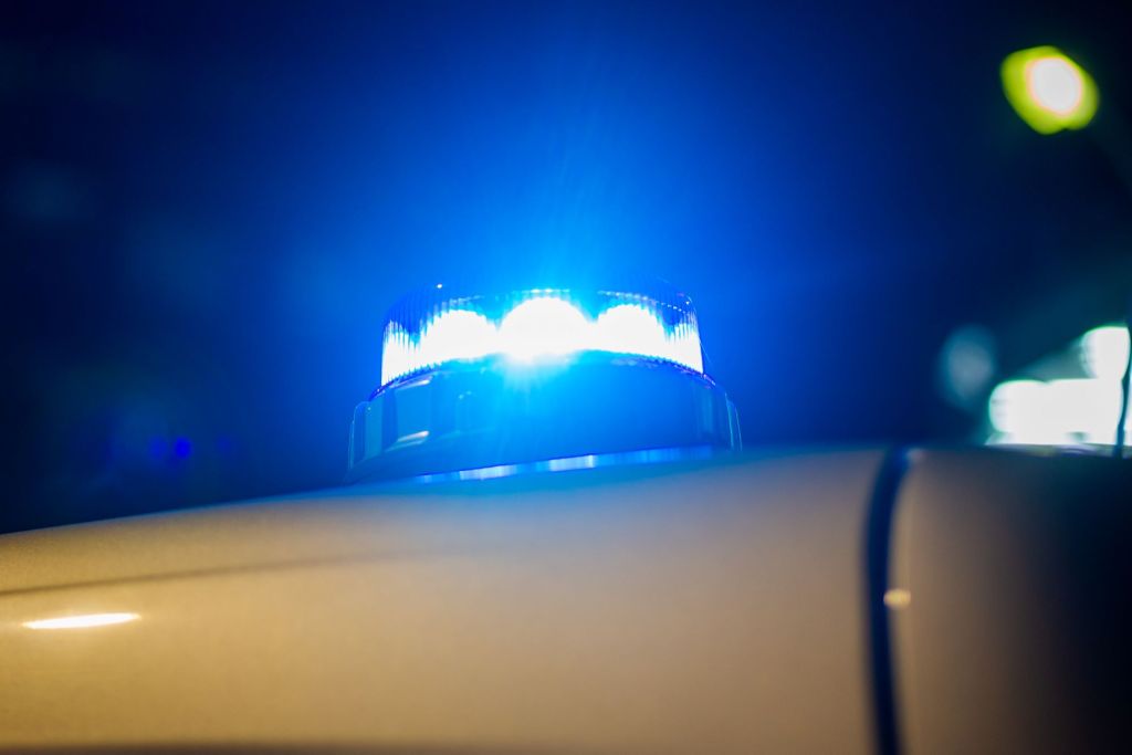 The blue light of a police car | Getty Images